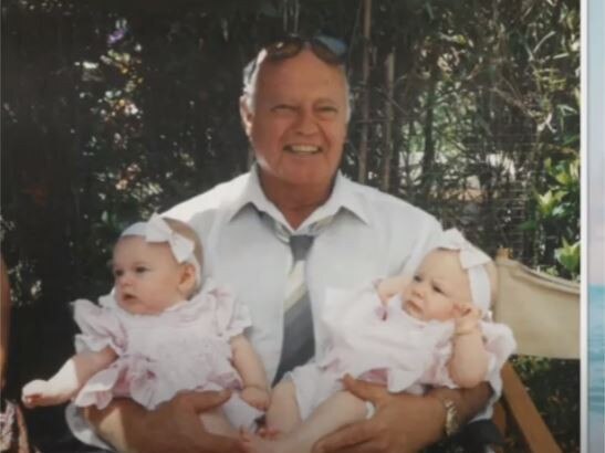 Robert Driver was allegedly knocked from his walker in an “unprovoked attack” at Bolton Clarke’s Lake Macquarie aged care facility on August 20.,  Robert with his twin granddaughters