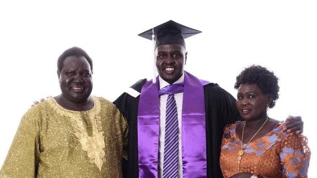 Alier Riak with his dad James and mother Elizabeth. Picture: Supplied.