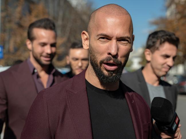 Andrew Tate talks to the media outside the Court of Appeal last month in Bucharest, Romania. Picture: Getty Images.