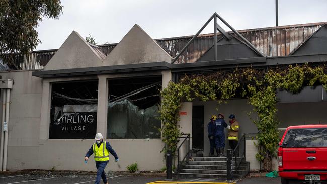 Fire investigators at the scene of the Stirling Village Shopping centre fire on Monday after it was completely destroyed. Picture: Naomi Jellicoe