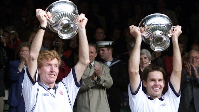 Mark Woodforde (left) &amp; Todd Woodbridge with their trophies after they defeated Haarhuis &amp; Stolle in men's Doubles final match of 2000 Wimbledon Championhips.