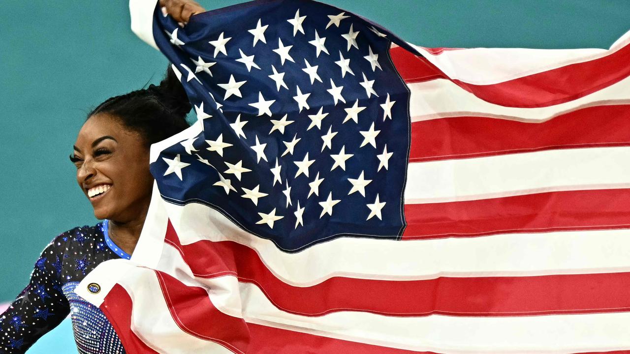 Biles was understandably all smiles after cementing her status as one of the all-time greats. Picture: Gabriel Bouys/AFP
