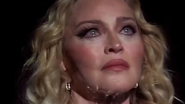 Madonna broke down in tears on stage as she remembered a friend who died while she held their hand. Picture from X.