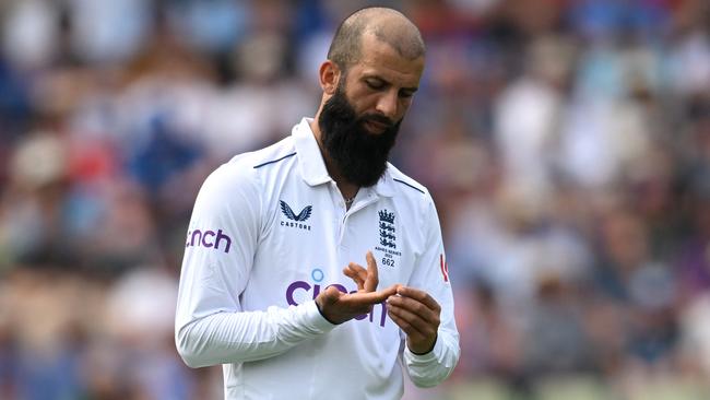 Moeen Ali of England looks at his finger after bowling during day three of the Ashes Test match between England and Australia at Edgbaston.