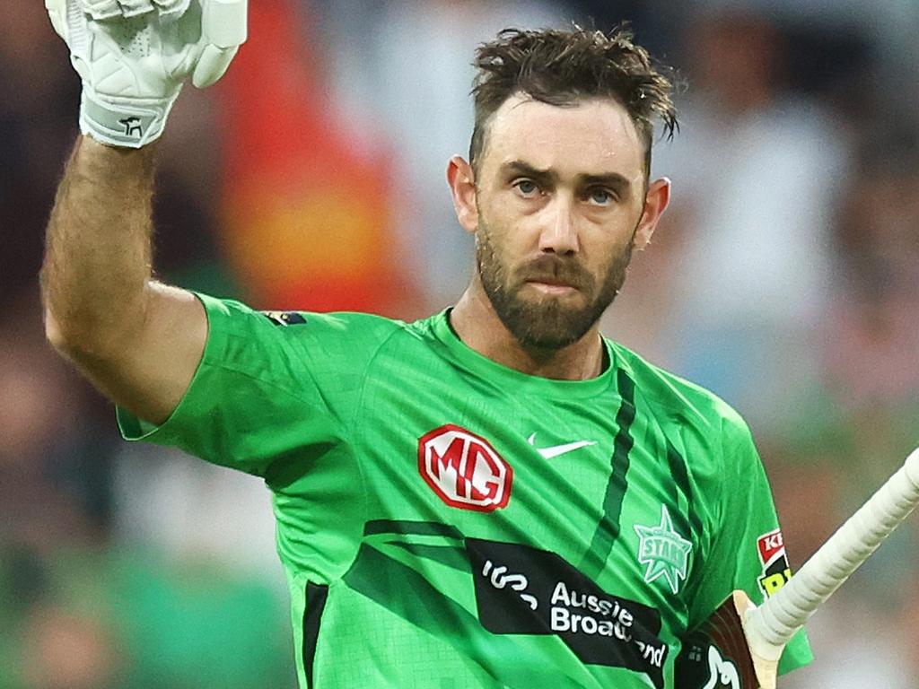 MELBOURNE, AUSTRALIA - JANUARY 19: Glenn Maxwell of the Stars raises his bat after scoring a century during the Men's Big Bash League match between the Melbourne Stars and the Hobart Hurricanes at Melbourne Cricket Ground, on January 19, 2022, in Melbourne, Australia. (Photo by Mike Owen/Getty Images)
