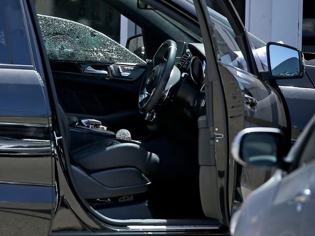 The shattered window and blood-splattered car interior. Picture: Toby Zerna