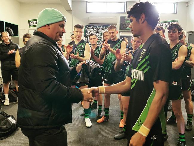 Josiah Kyle is presented with his jumper by Doveton great Daniel Charles. Picture: Facebook