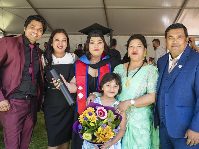 Bachelor of Nursing graduate Nayana Maharjan with her family (from left) Nabin, Sunita, Navya, Tara and Rabindra Maharjan at a UniSQ graduation ceremony at Empire Theatres, Tuesday, October 31, 2023. Picture: Kevin Farmer