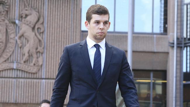 Liverpool football player Jon Flanagan walks outside Liverpool Magistrates' Court, in Liverpool, England, Wednesday Jan. 17, 2018. Flanagan must do 40 hours of unpaid work and attend 15 rehabilitation activity days as part of a 12-month community order for assaulting his girlfriend. The 25-year-old Flanagan pleaded guilty to assault for kicking his girlfriend on a night out in Liverpool last month. (Peter Byrne/PA Wire/PA via AP)