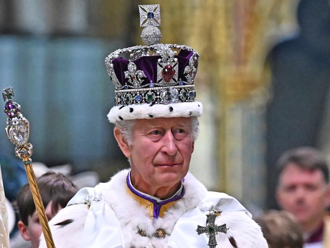 LONDON, ENGLAND - MAY 06: Britain's King Charles III wearing the Imperial state Crown carrying the Sovereign's Orb and Sceptre leaves Westminster Abbey after the Coronation Ceremonies on May 6, 2023 in London, England. The Coronation of Charles III and his wife, Camilla, as King and Queen of the United Kingdom of Great Britain and Northern Ireland, and the other Commonwealth realms takes place at Westminster Abbey today. Charles acceded to the throne on 8 September 2022, upon the death of his mother, Elizabeth II. (Photo by Ben Stansall  - WPA Pool/Getty Images)