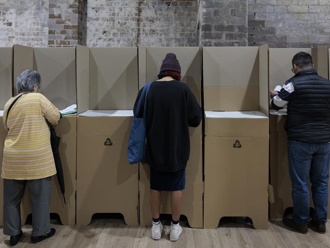 SYDNEY, AUSTRALIA - MAY 20: People cast their ballots during early voting for the seat of Wentworth at Oxford Street Mall on May 20, 2022 in Sydney, Australia. Independent Allegra Spender is standing for the seat of Wentworth against Liberal incumbent Dave Sharma. The Australian federal election will be held on Saturday 21 May 2022. (Photo by Brook Mitchell/Getty Images)