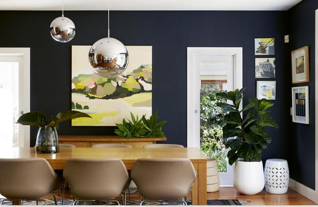 A Belynda Henry artwork brings colour to the dining room. Picture: Zan Wimberley