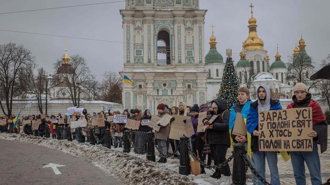 Relatives and friends of Ukrainian military prisoners of war hold placards during a rally calling for their quick exchange with Russian prisoners of war in Kyiv. Picture: Roman Pilipey/AFP