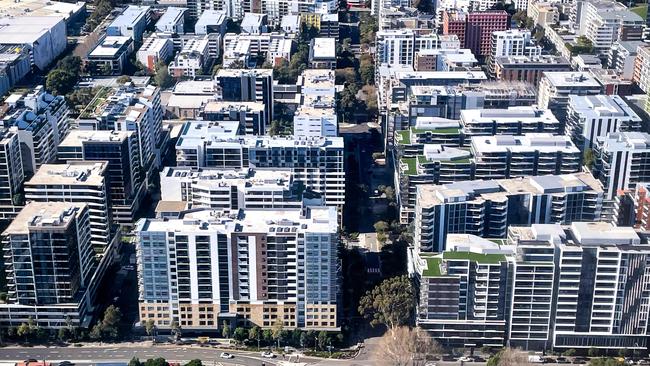 A photo taken on June 16, 2024 shows an aerial view of newly constructed apartment blocks located in the Sydney suburb of Mascot. (Photo by DAVID GRAY / AFP)