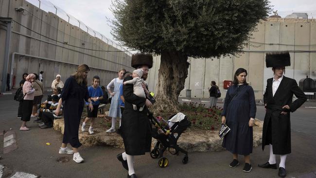 Ultra-Orthodox Jewish pilgrims gather next to the concrete wall protecting Rachel's Tomb, Judaism's third holiest shrine, located in the West Bank town of Bethlehem on October 5, 2023, before the Hamas attack. Picture: Menahem Kahana/AFP