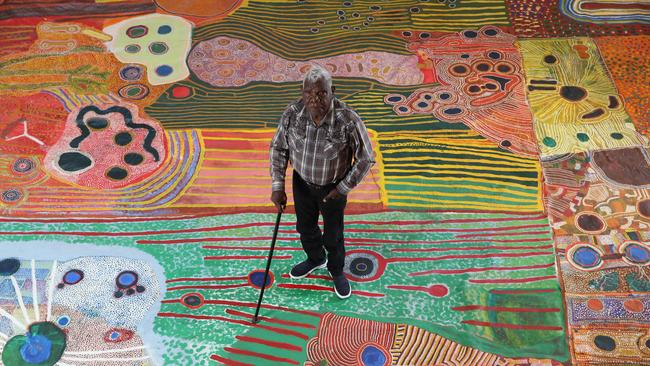 Artist Tommy May with the Ngurrara canvas in 2019. Picture: Britta Campion