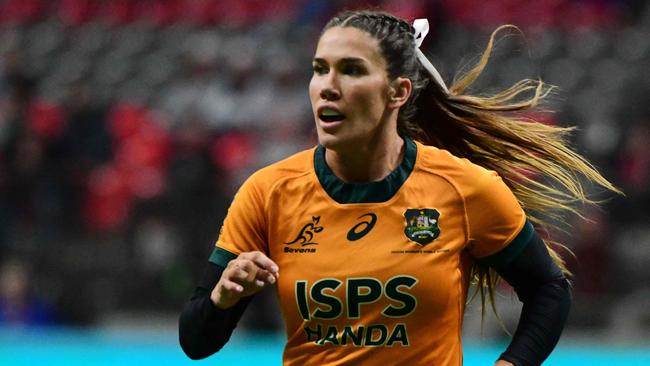 Australiaâs Charlotte Caslick in action during the 2024 HSBC Canada Sevens rugby tournament match between Australia and Fiji at BC Place Stadium in Vancouver, Canada, on February 23, 2024. (Photo by Don MacKinnon / AFP)