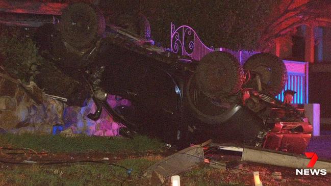 A 20-year-old driver has been taken to hospital after his ute flipped on its roof after crashing into a Stobie pole at Torrens Park. Picture: 7NEWS