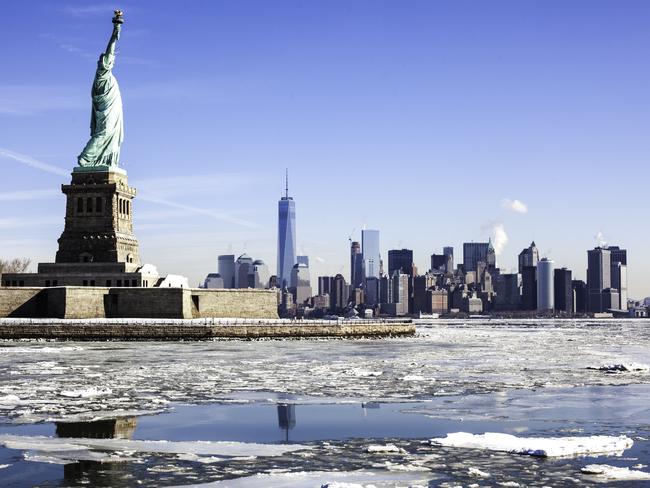 New York City, NY, USA - February 24, 2015: View of Statue of Liberty and tip of Manhattan. Weather phenomenon known as Polar Vortex / Siberian Express arrives from the arctic and freezes the Hudson River. Chunks of ice sheets form and flow on the Hudson river. View of Statue of Liberty, One World Trade Center and Battery Park City. Downtown NYC. Photo: iStockEscape 2 March 2025Why I Travel