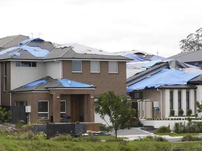 The roofs of several houses in Beaumont Hills are still covered in tarps after the hailstorm. Picture: David Swift