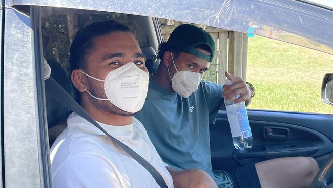 Getting their drive-through Pfizer jab at the Gold Coast on Tuesday were two NRL footy players from the Parramatta Eels, Isaiah Papali’i, 23 and Hayze Perham, 22. Photo: Emily Toxward