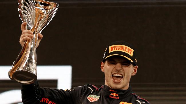 Max Verstappen celebrates on the podium of the Yas Marina Circuit