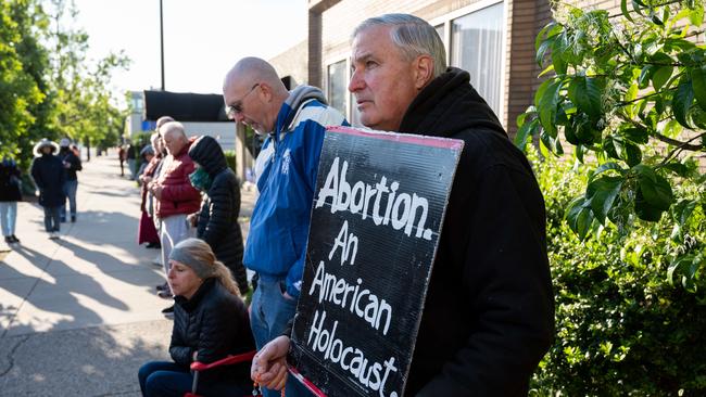 A pro-life demonstrator stands with his sign in front of EMW Women's Surgical Center, an abortion clinic, in May in Louisville, Kentucky. Picture: AFP