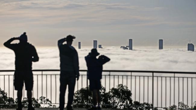 Brisbane City covered in fog, seen from the Mt Coot-Tha Summit Lookout. Picture: Zak Simmonds