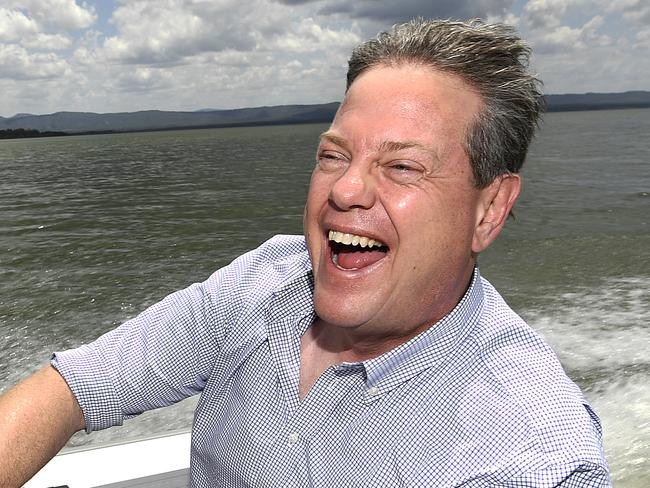 Queensland LNP leader Tim Nicholls drives a boat on the Peter Faust Dam in Proserpine, Friday, November 3, 2017. Mr Nicholls, in Proserpine as part of the 2017 Queensland election campaign, announced the LNP would build $1.3 billion of critical water infrastructure. (AAP Image/Dave Hunt) NO ARCHIVING