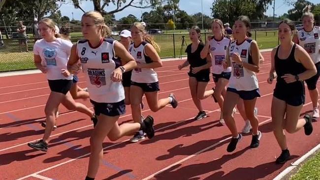 The Dragons girls on the training track.