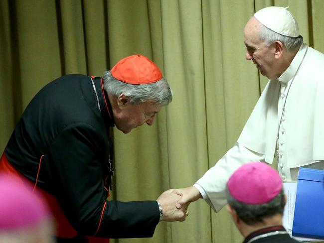 Pope Francis greets Cardinal George Pell in October, 2015. Picture: Franco Origlia/Getty Images