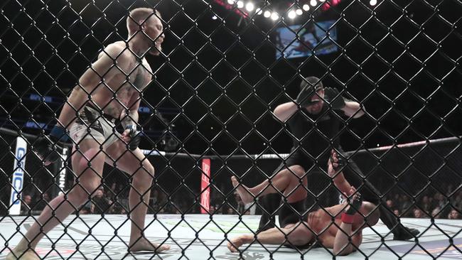 Conor McGregor reacts after the referee stopped his lightweight title clash.