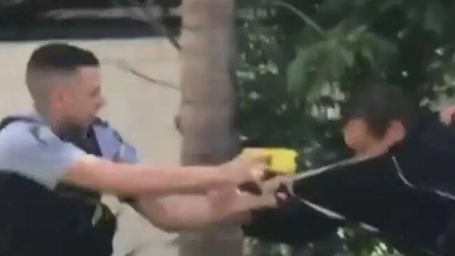 An officer tasers the 32-year-old during the dramatic struggle. Picture: Supplied.