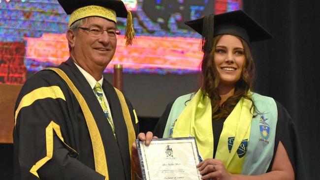 PROUD RESULT: CQUniversity Chancellor John Abbott with graduate Shae Marr. Picture: Contributed