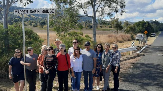 Warren Dakin Bridge has been named after a fifth generation farmer, stalwart and volunteer who gave his life and time to the community of Theebine. Members of the Dakin family stand under the bridge in respect for their beloved relative. Picture: supplied