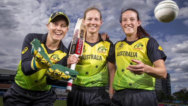 Australian players Alyssa Healy, left, Meg Lanning and Megan Schutt warm up for their must-win World Cup match against NewZealand at the Junction Oval. Picture: Wayne Taylor