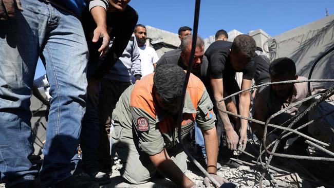 Rescuers search for survivors under the rubble. Picture: AFP