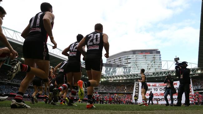 St Kilda runs out at Etihad. Developer Michael Buxton says the entire stadium should be knocked down. Picture: George Salpigtidis