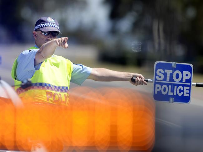 Members of Central Coast Highway Patrol conduct RBT on drivers, in the lead up to Christmas, at Wilfred Barrett Drive, North Entrance.