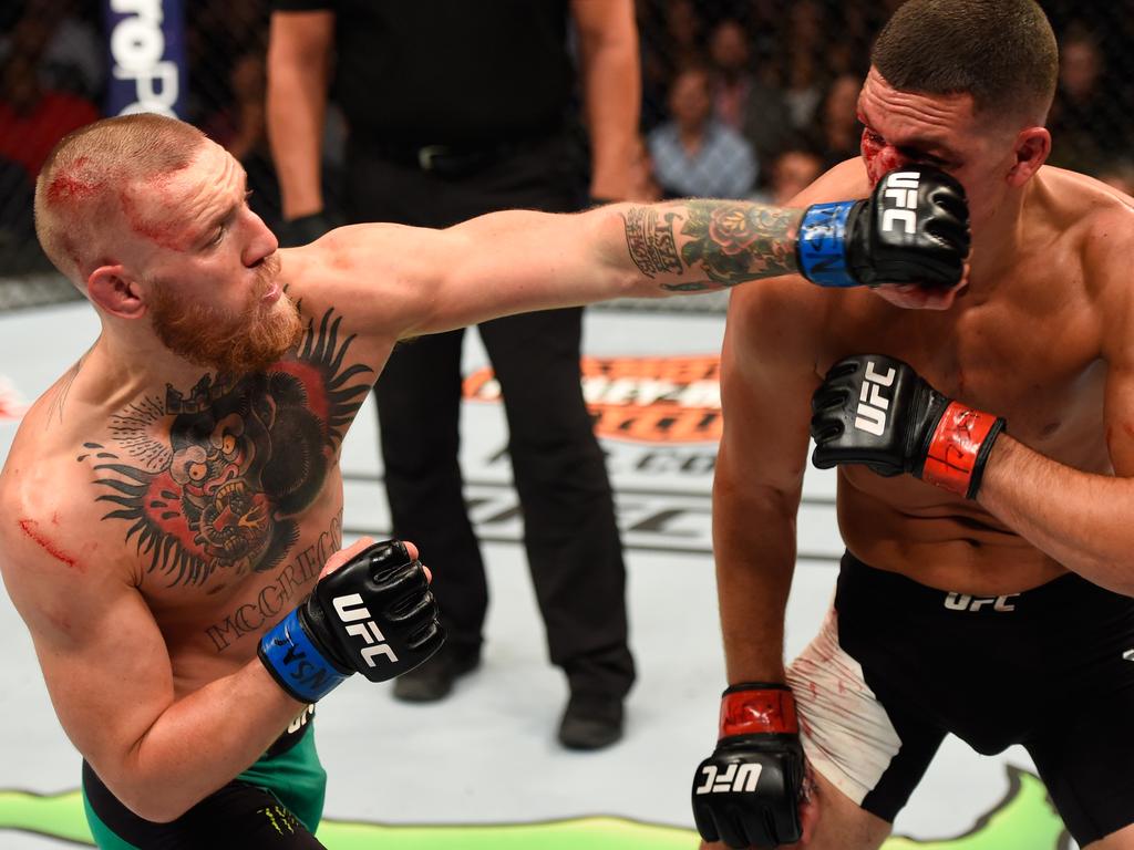 McGregor punches Nate Diaz in their welterweight bout during the UFC 202 event at T-Mobile Arena on August 20, 2016 in Las Vegas. Picture: Josh Hedges/Zuffa LLC/Zuffa LLC via Getty Images