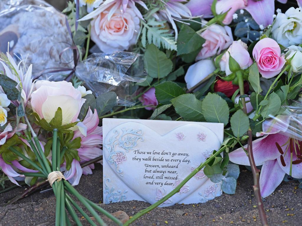 They laid flowers, teddy bear and candles at the grave. Picture: Tom Huntley