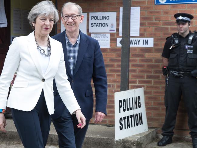 The heat is on for Theresa May, pictured with husband Philip at a polling station near Maidenhead, England. Picture: Matt Cardy/Getty Images