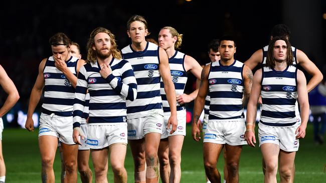 ADELAIDE, AUSTRALIA - JUNE 22: Geelong Cats players walk from the ground looking dejected during the round 14 AFL match between the Port Adelaide Power and the Geelong Cats at Adelaide Oval on June 22, 2019 in Adelaide, Australia. (Photo by Daniel Kalisz/Getty Images)