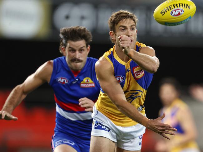 AFL Round 16. Western Bulldogs vs West Coast Eagles at Metricon Stadium. 05/09/2020...   Brad Sheppard of the Eagles clears by hand infant of Josh Bruce of the Bulldogs  . Pic: Michael Klein