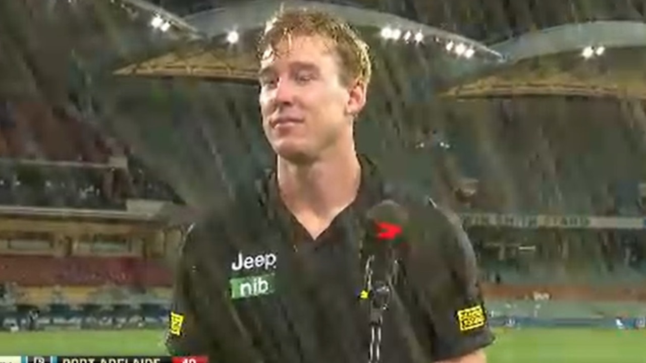 Tom Lynch was soaked by a drink thrown by a fan.