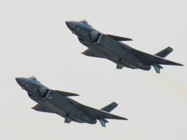 A pair of J-20 stealth fighter jets fly at the China's International Aviation and Aerospace Exhibition in Zhuhai, China's Guangdong province. Picture: Chinatopix Via AP