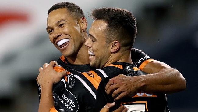 Moses Mbye (left) wants an early exit from his West Tigers deal.