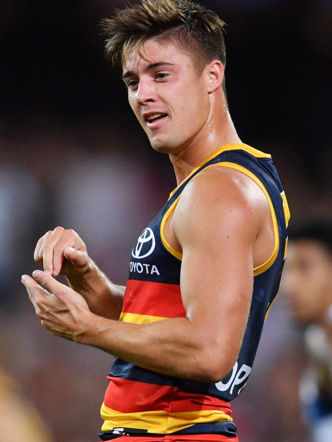 Riley Knight celebrates after kicking a goal against Geelong in round three. Picture: DAVID MARIUZ (AAP).