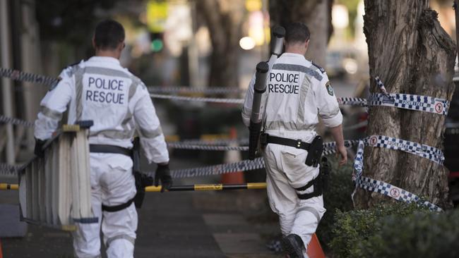 Police carry out a raid of a Surry Hills property related to the arrests.