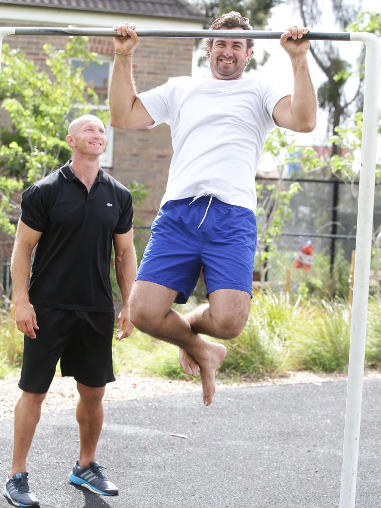 Crocodile hunter Matt Wright shows Adam MacDougall how he trains outdoors. Picture: Cameron Richardson